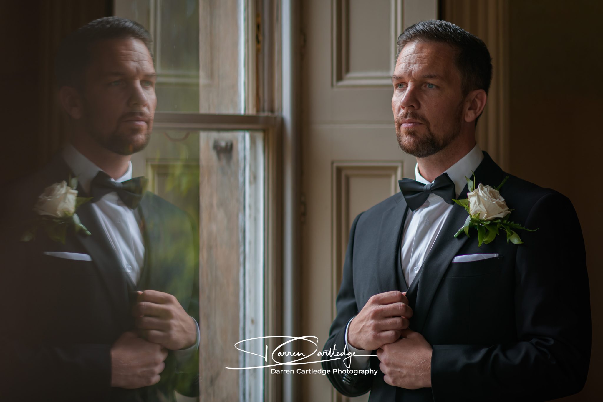 groom final preparations portrait window reflection yorkshire wedding 2048x1365